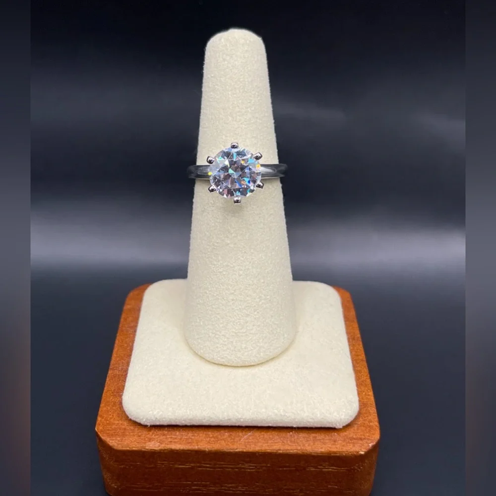 Two (2) carat cz solitaire in a 925 sterling silver setting. Size 6.25.